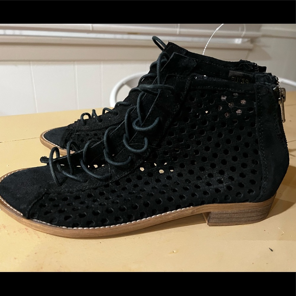 Never worn black holy flat tie shoes